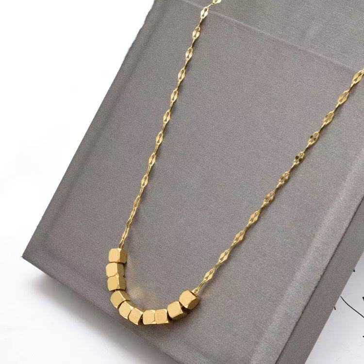 Paired with a gold small square necklace for women in the spring and summer of 2025, this is a light luxury niche design with a high-end titanium steel feel